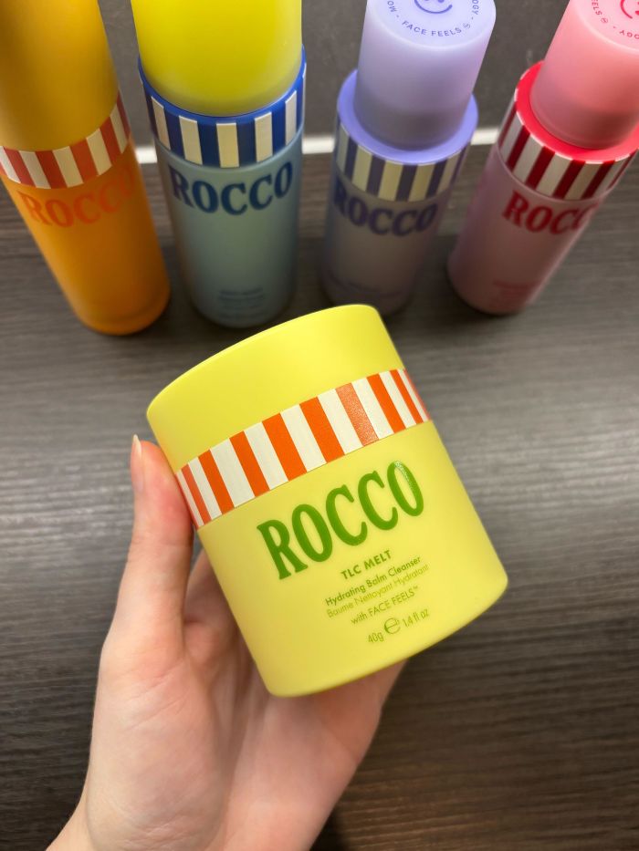 Deputy beauty editor Grace Lindsay holding the Rocco TLC Melt Hydrating Balm Cleanser