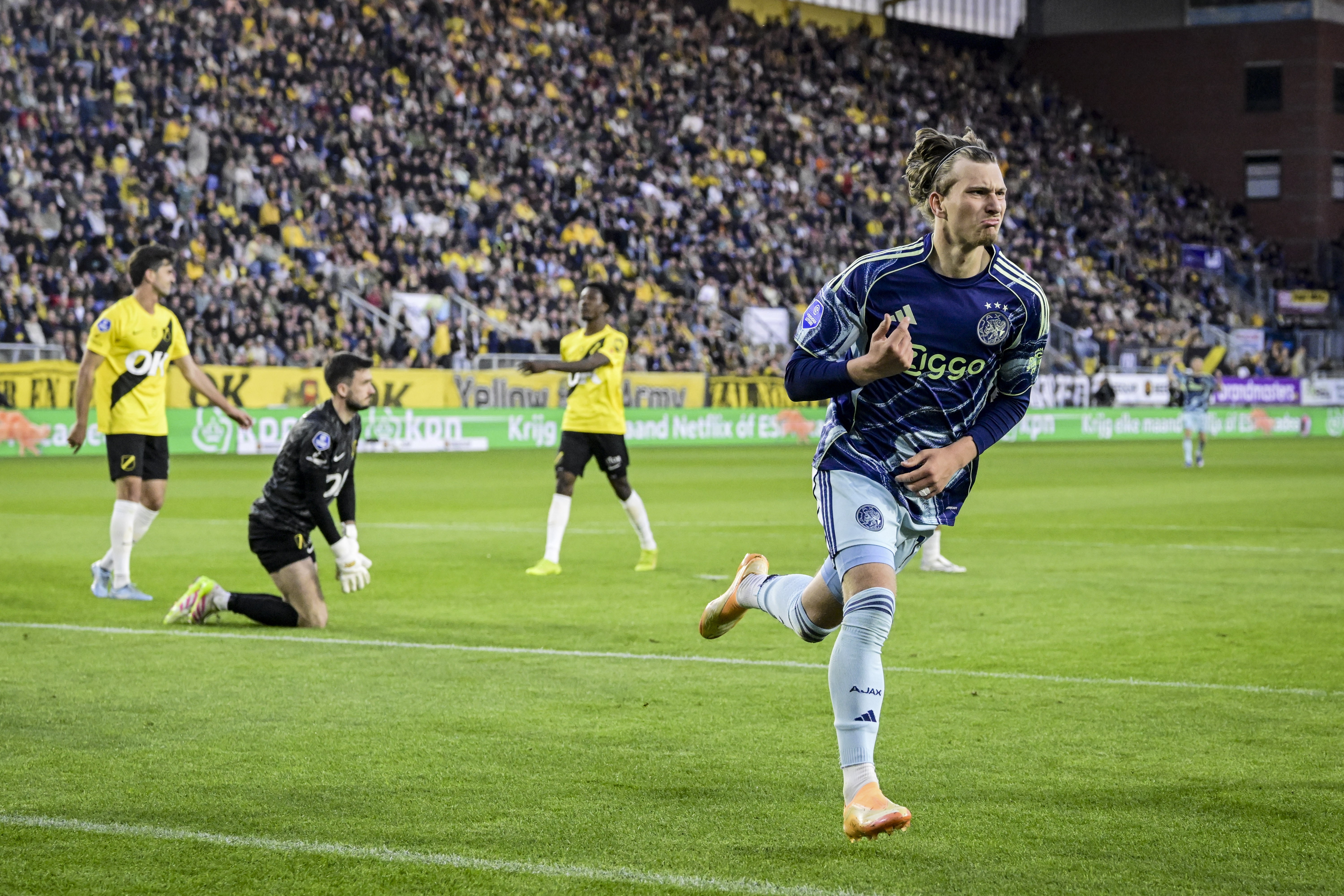 BREDA - Mika Godts of AFC Ajax celebrates scoring the 0-2 during the Dutch Eredivisie match between NAC Breda and AFC Ajax at the Rat Verlegh Stadium on April 25, 2026, in Breda, the Netherlands. OLAF KRAAK / ANP (Photo by ANP via Getty Images)