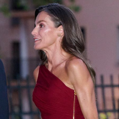 Queen Letizia wearing a one shouldered red dress