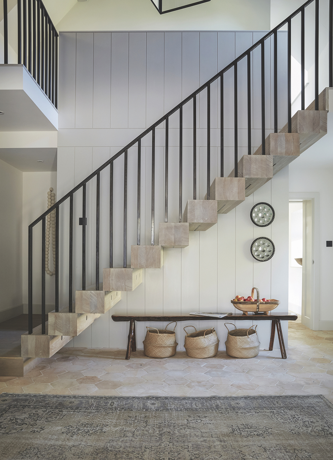 rustic hallway with bench and large area rug