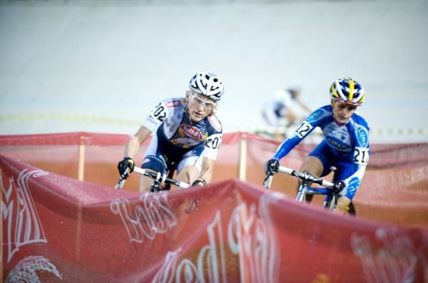 Sue Butler and Katerina Nash approach the barriers in the first lap of the Elite Women's race.