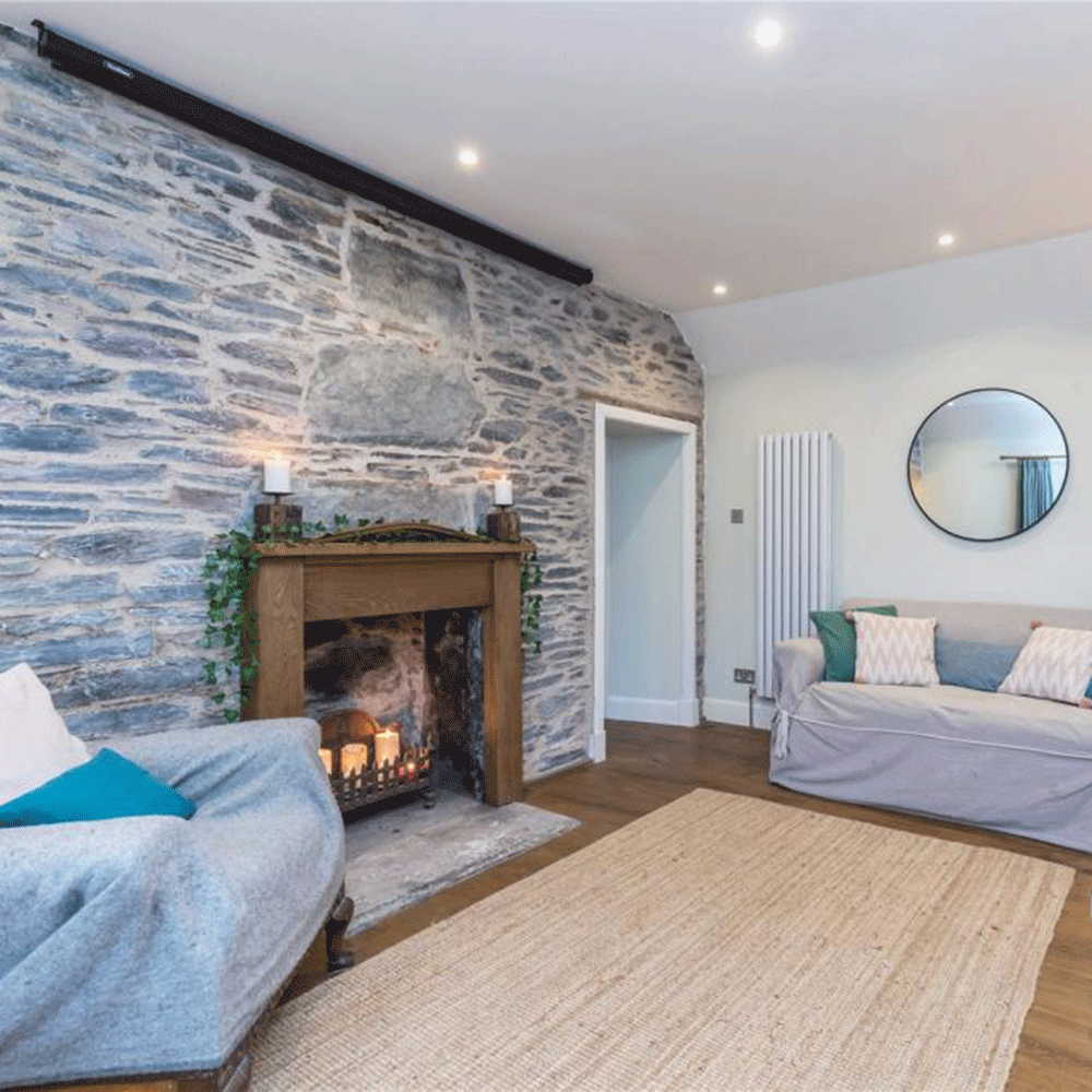 stone wall in living room with fireplace