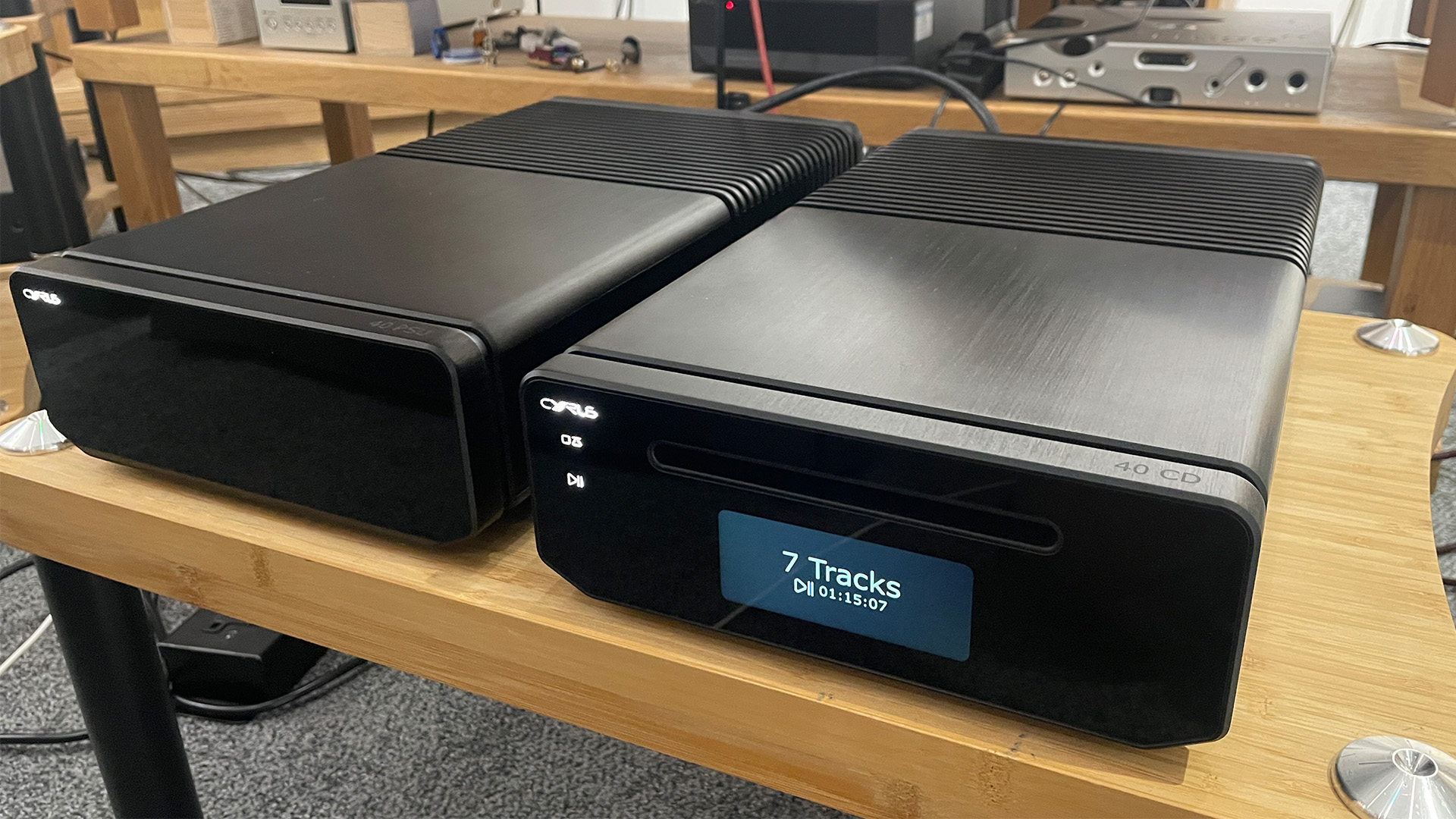 Cyrus 40 CD CD player on wooden hi-fi rack next to 40 PSU power supply