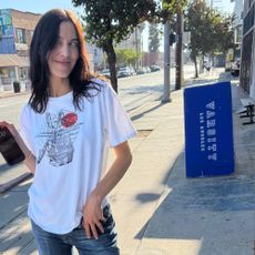 Alexa Chung wears soft ballet flats with jeans and a tee and a butter yellow maxi dress.