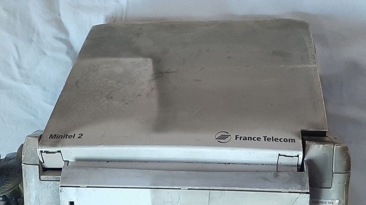 Alcatel and France Telecom logos on melted Alcatel Minitel 2