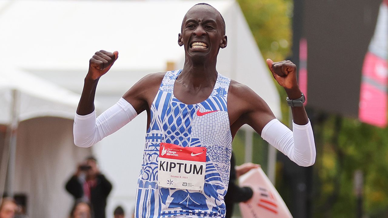 CHICAGO, ILLINOIS - OCTOBER 08: Kelvin Kiptum of Kenya celebrates as he crosses the finish line to win the 2023 Chicago Marathon professional men&#039;s division and set a world record marathon time of 2:00.35 on October 08, 2023 in Chicago, Illinois. (Photo by Michael Reaves/Getty Images)