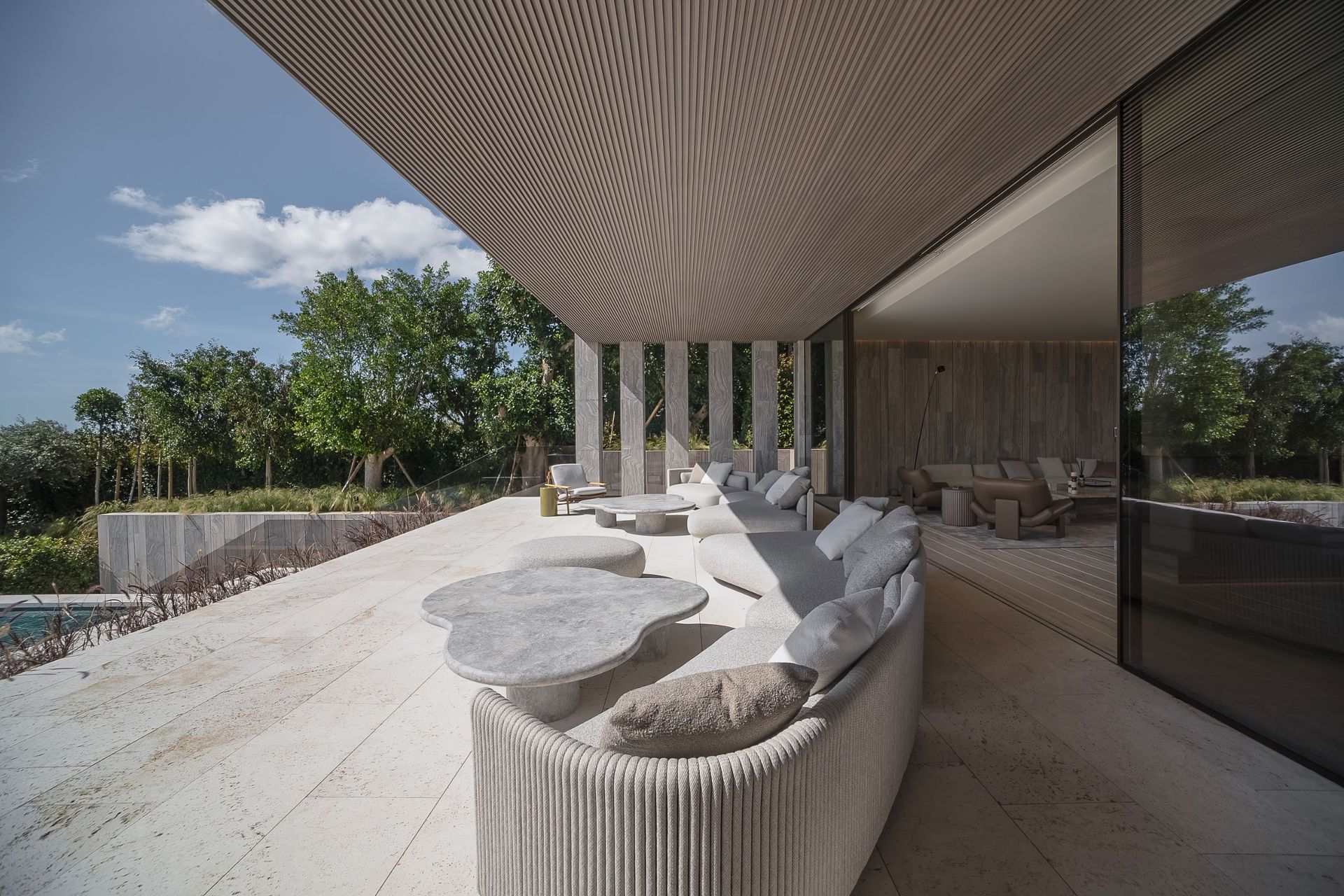 Villa ENSO by ARK Architects in Sotogrande, a luxurious villa with concrete and stone surfaces and swimming pools