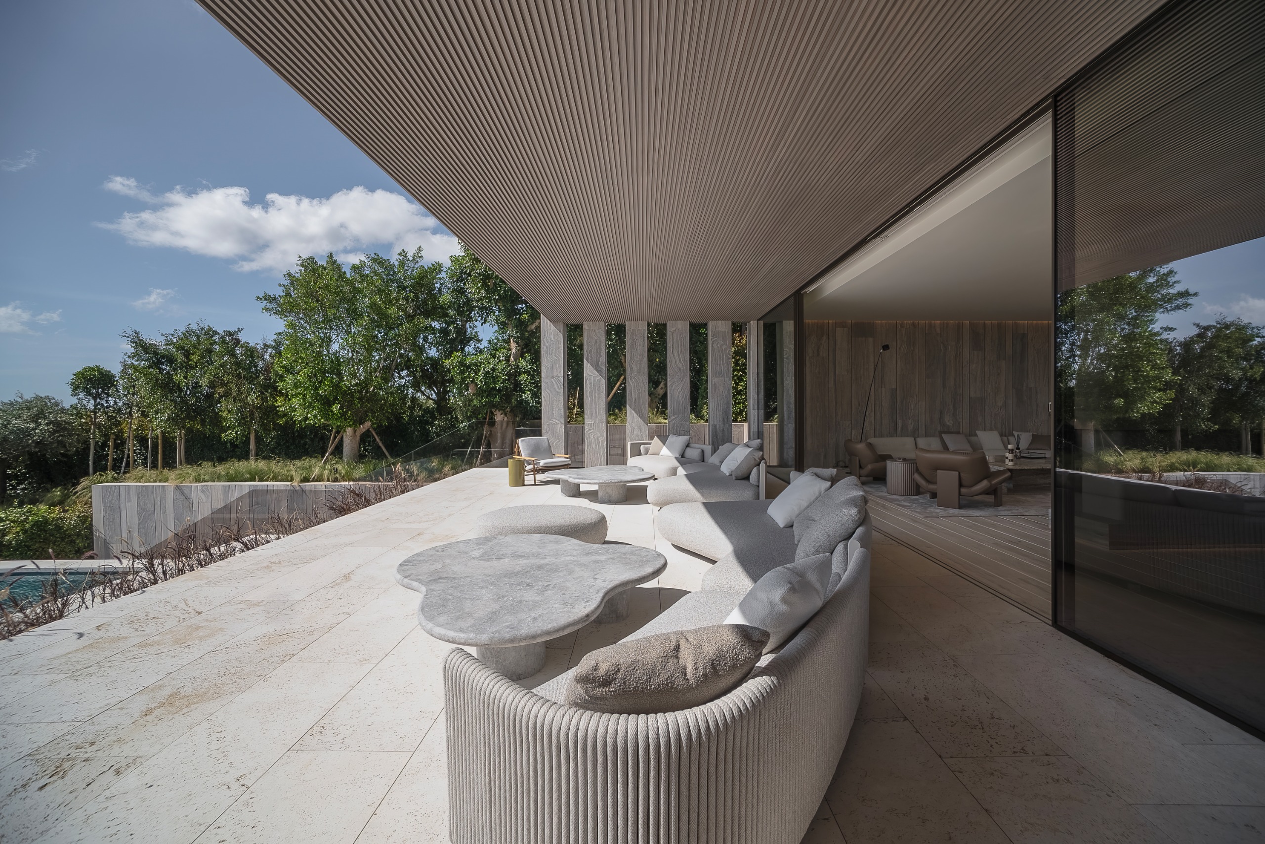 Villa ENSO by ARK Architects in Sotogrande, a luxurious villa with concrete and stone surfaces and swimming pools
