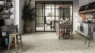 a large farmhouse style kitchen with heritage star white tiles from porcelain superstore, butcher's block, freestanding units and metal frame internal doors