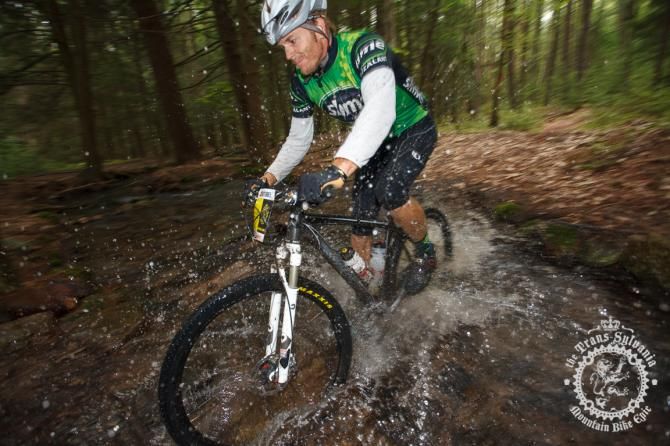 John Merriam rolls through a water crossing at the end of the second enduro segment