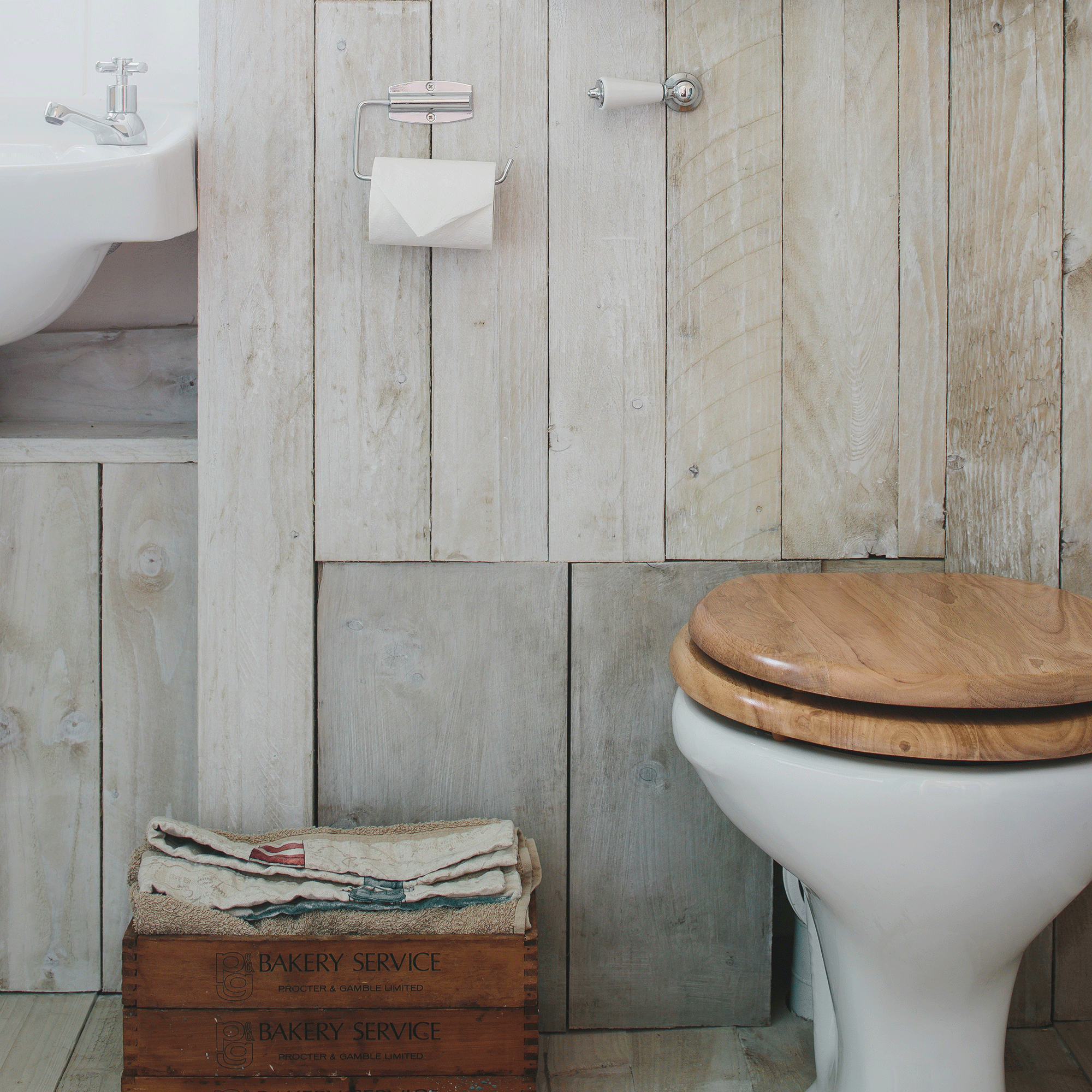 Wooden toilet seat in bathroom