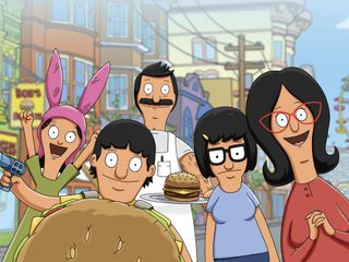 bobs burgers characters holding a burger and one of them wearing a burger costume