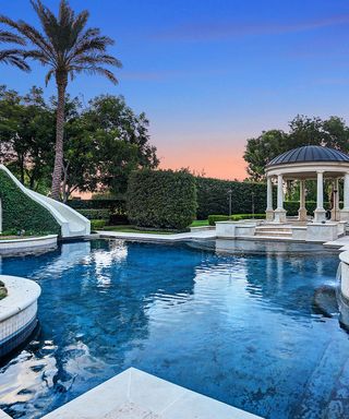 Tracy McGrady's backyard with large swimming pool and palm trees