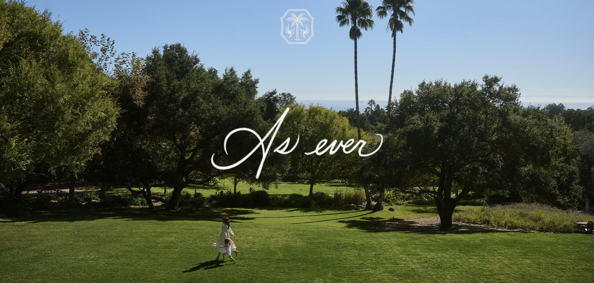 Meghan Markle and Princess Lilibet running through the backyard of their house in flowy dresses with trees and the ocean in the background