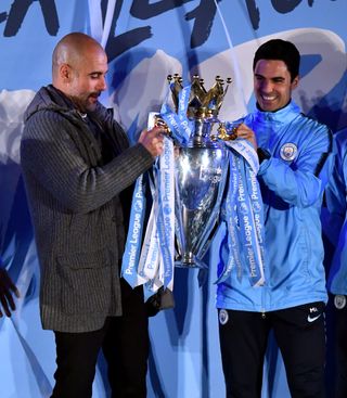 Manager Pep Guardiola joined in City's title celebrations