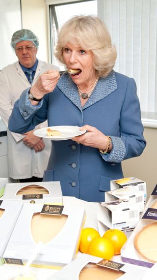 Camilla eating cake.