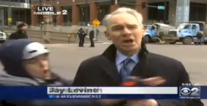 Watch a Chicago reporter fend off an anti-Obama protester on live TV