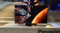 Panasonic Z85C with sci-fi images on screen sitting on a wooden tabletop