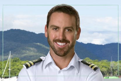 A close up of Luke Jones from Below Deck Down Under in his uniform