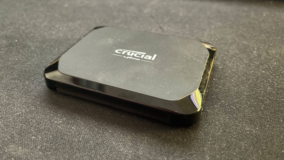 Crucial X9 external SSD on a desk mat