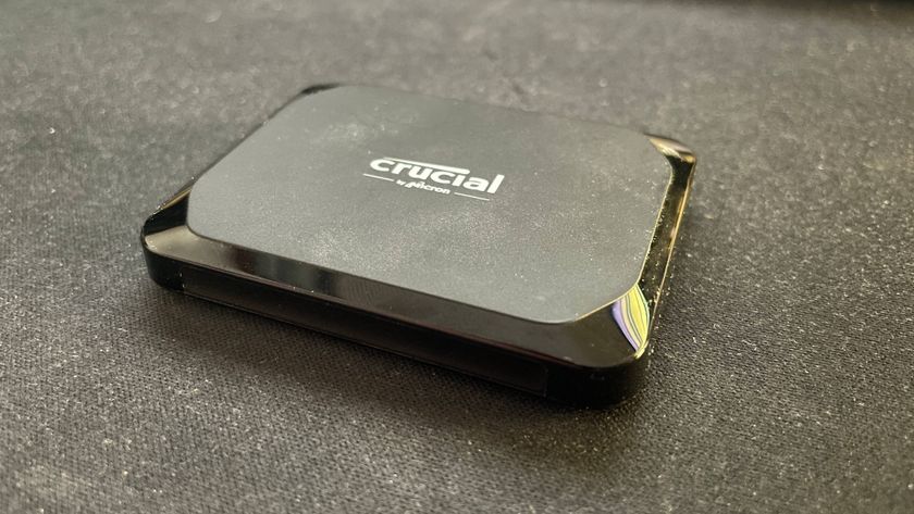 Crucial X9 external SSD on a desk mat