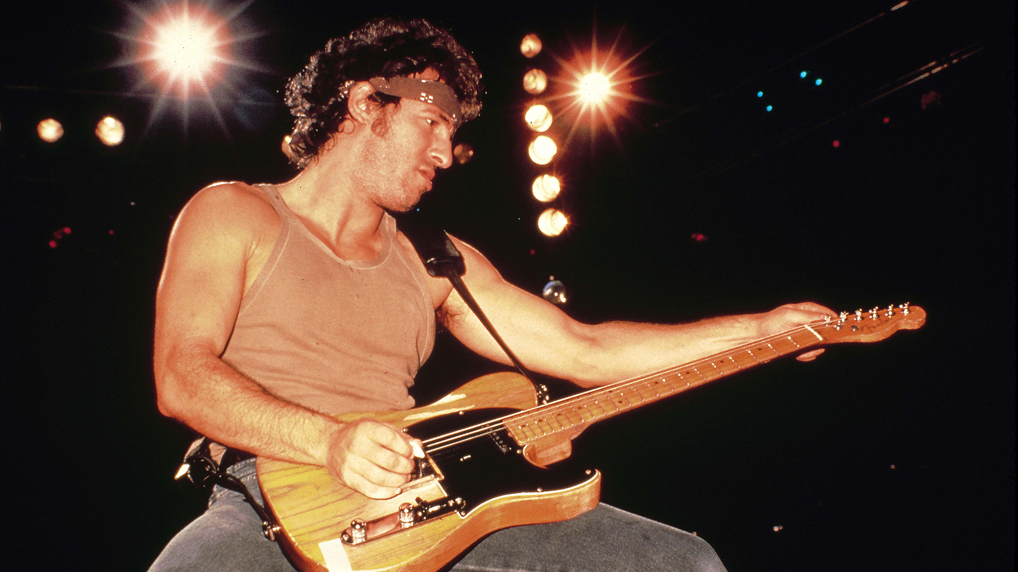 Photo of Bruce SPRINGSTEEN, performing live onstage on Born In The USA tour, playing Fender Telecaster guitar 