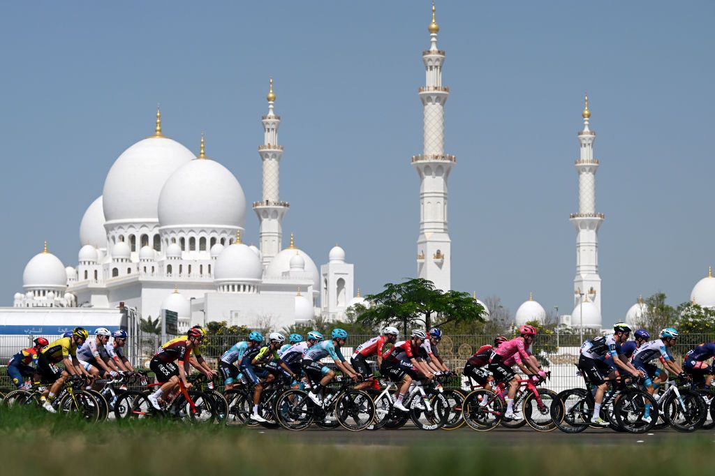 ABU DHABI UNITED ARAB EMIRATES FEBRUARY 22 A general view of Tadej Pogacar of Slovenia and UAE Team Emirates Red Leader Jersey and the peloton passing in front of the Sheikh Zayed Grand Mosque during the 7th UAE Tour 2025 Stage 6 a 165km stage from Abu Dhabi Cycling Club to Abu Dhabi Breakwater UCIWWT on February 22 2025 in Abu Dhabi United Arab Emirates Photo by Dario BelingheriGetty Images