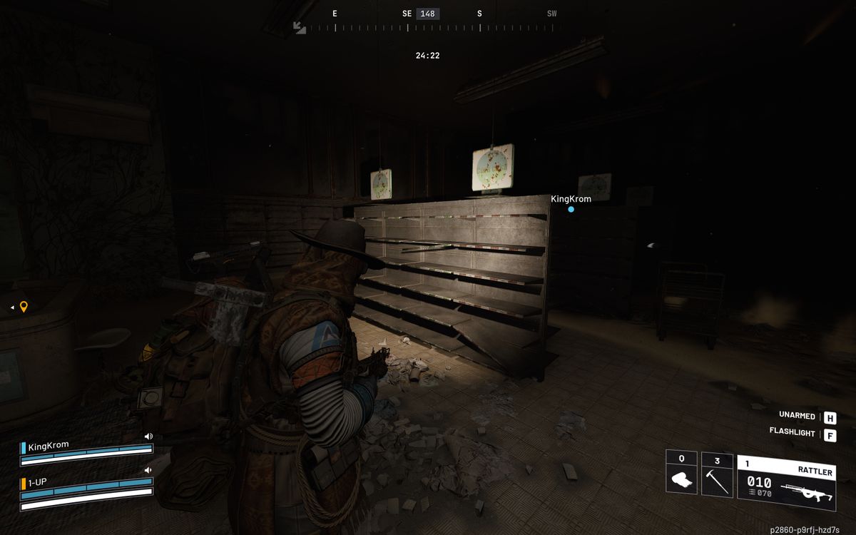 Arc Raiders cat bed location: A player looking at store shelves in a dark shop, using a flashlight.