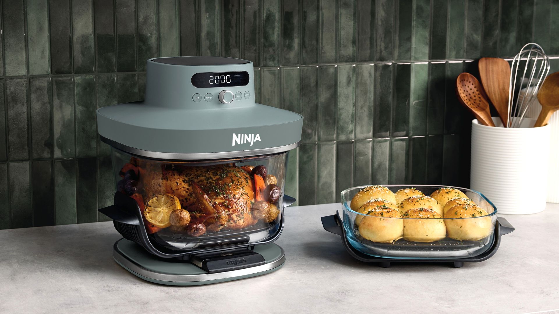 Ninja Crispi Pro air fryer with food on kitchen counter