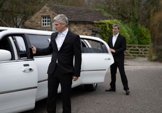 Caleb and Cain in suits getting into the limo