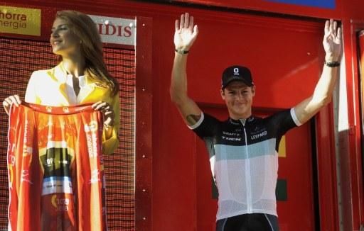 Jakob Fuglsang heads onto the podium to get the Vuelta's leader jersey