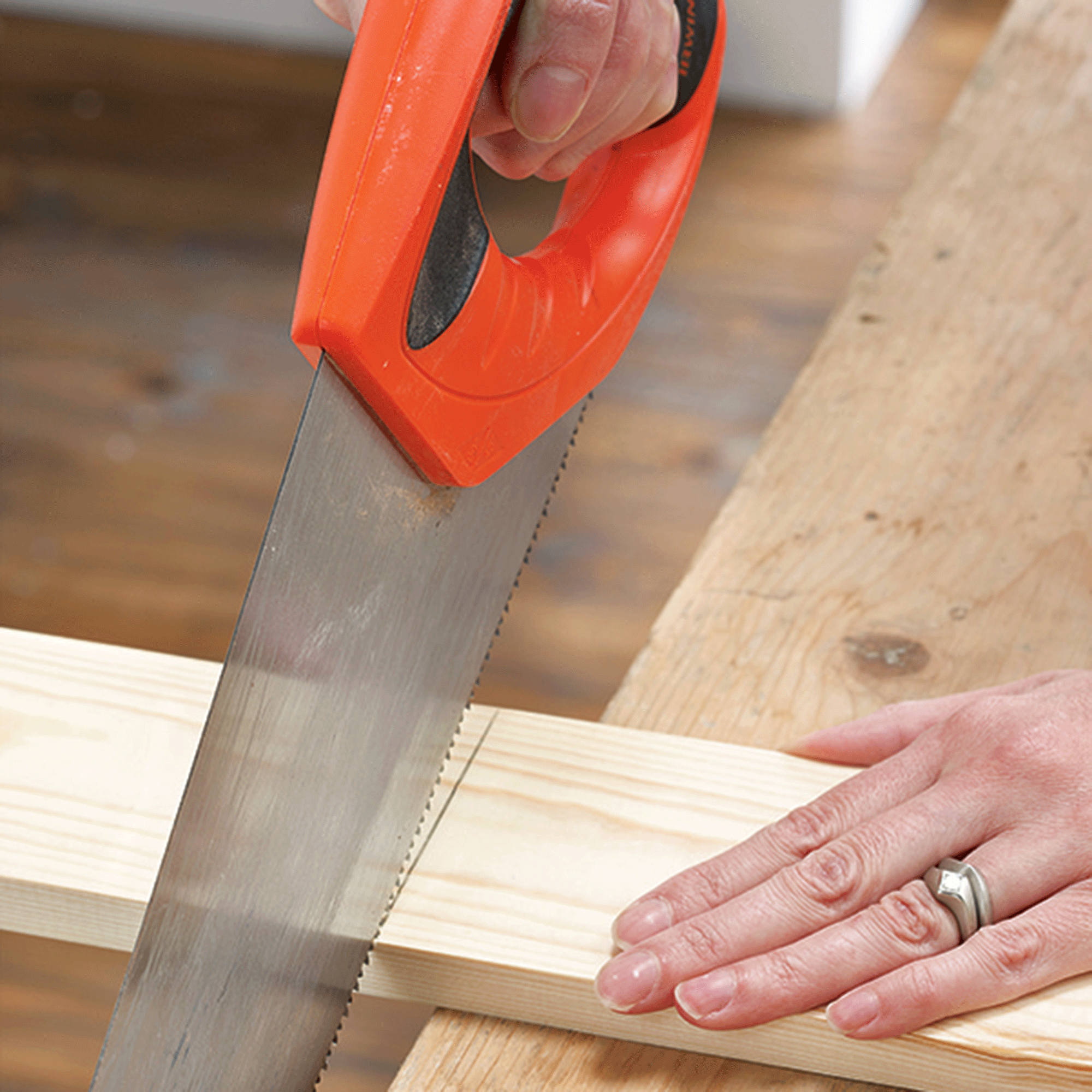 Saw cutting through wood