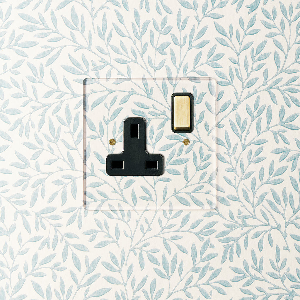 Lucian Perspex Single Socket in Clear Perspex With Black Inserts and Aged Brass Switch