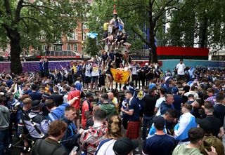 Scotland fans gathered in London's Leicester Square before the match against England
