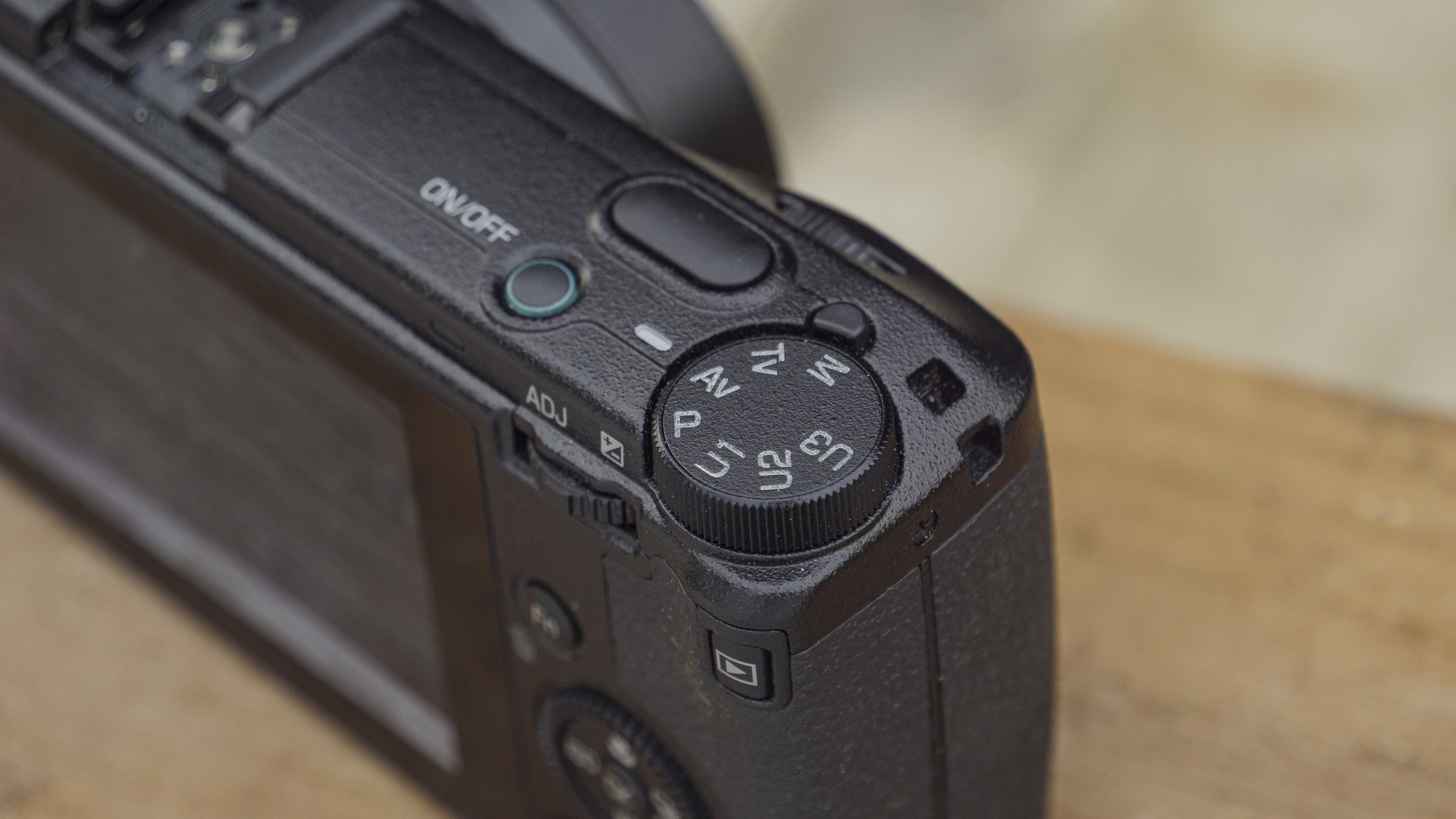 The Ricoh GR IIIx camera on a wooden table