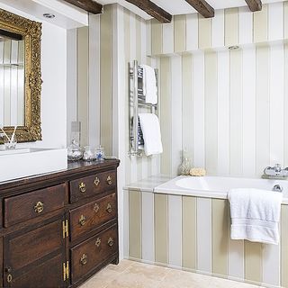 bathroom with bathtub and white washbasin