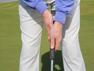 Left below right putting grip