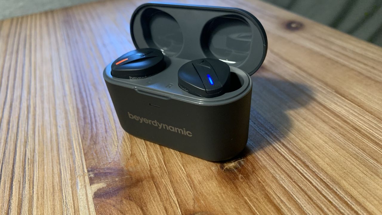 The Beyerdynamic Free Byrd true wireless earbuds in their case on a table