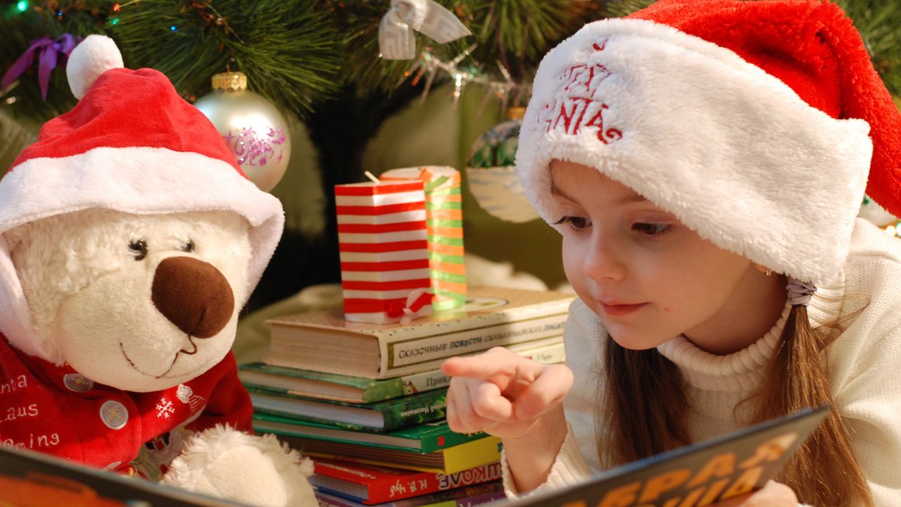 Girl in Santa hat on Christmas day 