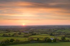 Sunset over beautiful rolling Devon countryside, Devon, England. Summer (June) 2013