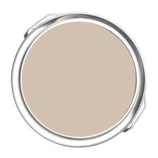 A round paint sample in light brown