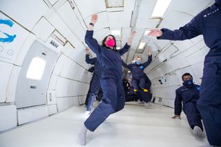 Space.com's Chelsea Gohd floats in lunar gravity in this photo from a Zero-G flight that simulates lunar, Martian and zero gravity.