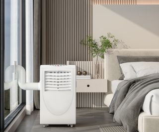 white portable air con unit in bedroom with white vent sticking out of window