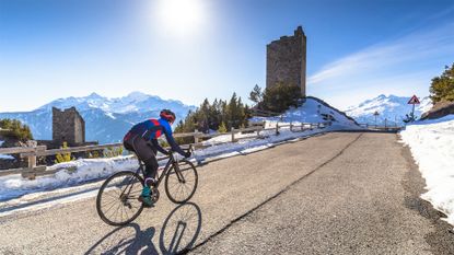 Cyclist against snowy backdrop