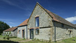 stone barn conversion with clay tiled roof