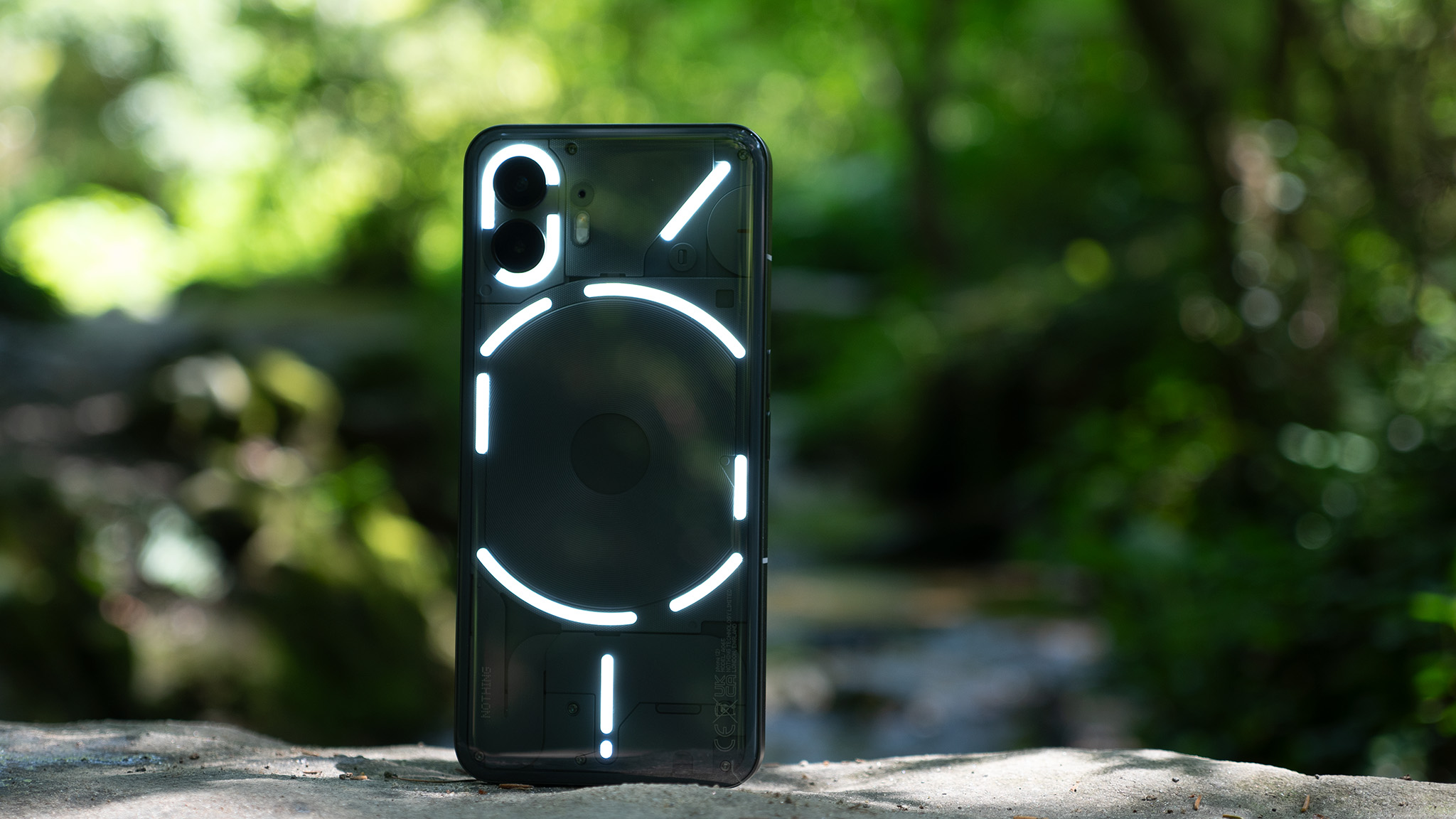 The Glyph lights illuminated on the back of a Nothing Phone (2)