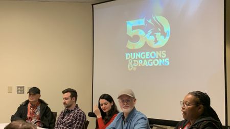 Panelists at GaryCon 2024 in front of a screen which reads "50 Dungeons & Dragons"
