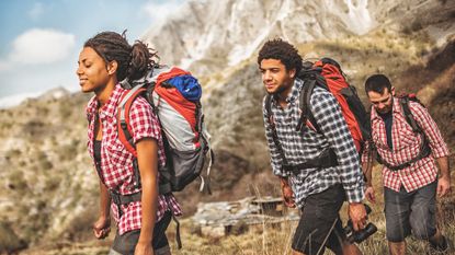 How to fit a rucksack: 3 hikers wearing backpacks