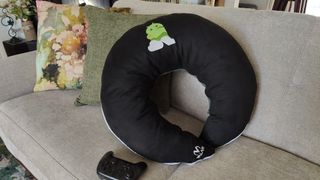 The Valari Gaming Pillow propped up on a couch.