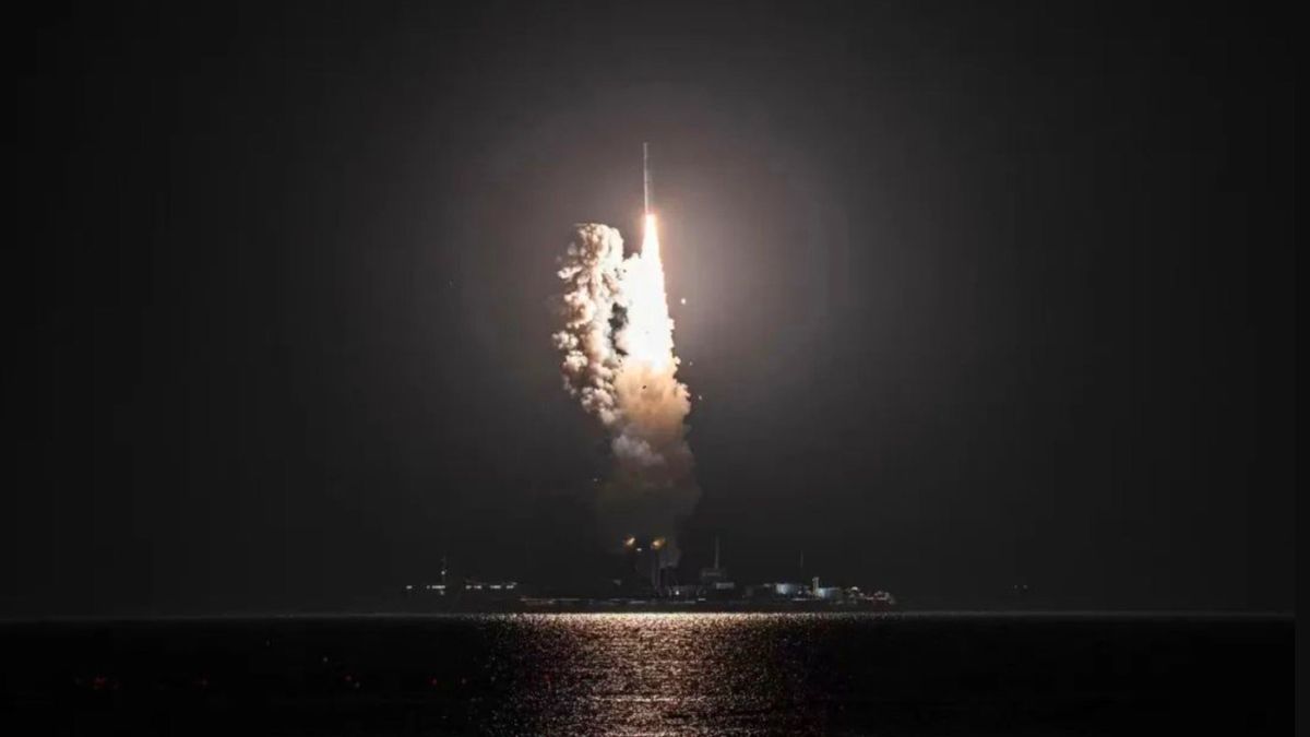 A Long March 11 rocket rises off a sea barge and into the night sky on Oct. 7, 2022.